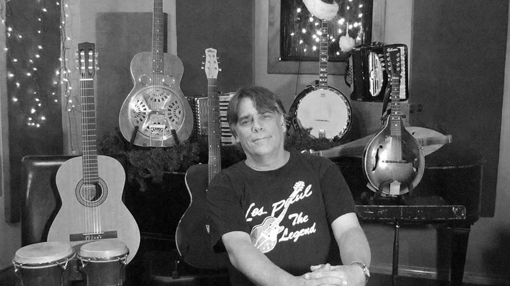 Photo of Chris Gage with instruments